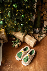 The room with a fireplace is decorated in a Christmas style. Cozy New Year's location with decor.