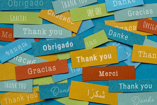 thank you in different languages, many thanks colorful papers, merci danke