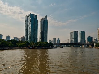 Fototapeta premium Chao Phraya River, bank and bridge view.