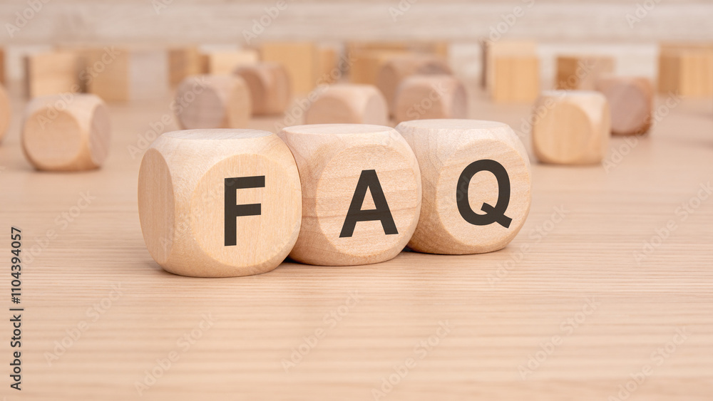 Poster wooden blocks featuring faq letters positioned on a table ready for use and exploration