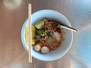 noodle with meetball in a blow