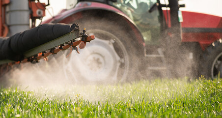Tractor spraying pesticides wheat field. © Dusan Kostic