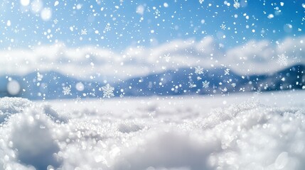 Fototapeta premium A clear picture of snowflakes falling from the sky near a mountain