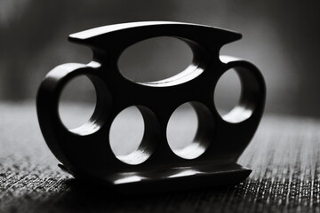 Black and white image of metal knuckledusters.