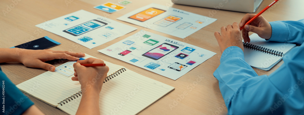 Poster panorama banner of startup company employee planning on user interface prototype for mobile applicat