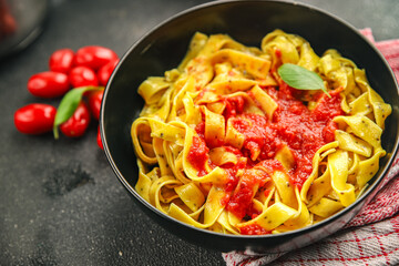 Pasta tagliatelle tomato sauce tasty food dish fresh delicious gourmet food background on the table rustic food top view copy space