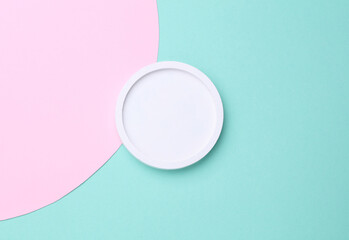 Plaster round tray on blue pink background. Minimalism, presentation, beauty showcase