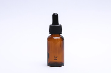 Glass Bottle of Facial Serum on white Background