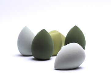 Eggs makeup sponges. Blenders for foundation on white background