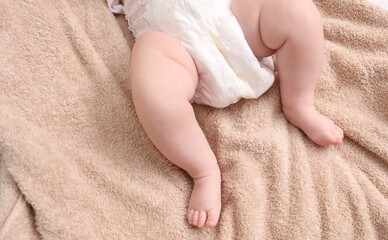 Newborn feet on a towel. Newborn care concept