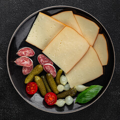 Raclette cheese tasty food dish fresh delicious gourmet food background on the table rustic food top view copy space top view