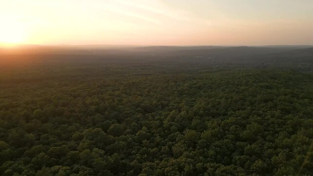 Beautiful golden hour landscape over the mountains, drone 4K