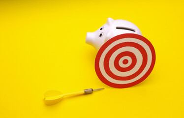 Target with darts and piggy bank. Business concept