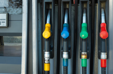 Colored Fuel nozzles at the petrol pump or gas station. Fuel and gas pump nozzle.