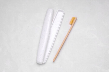White plastic case for storing toothbrush