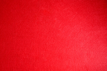 Red textured surface as background, top view
