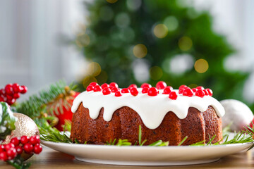 Traditional classic Christmas cake and decor on wooden table