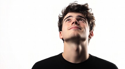 Young Man Gazing Upward with a Hopeful Expression Against White Background