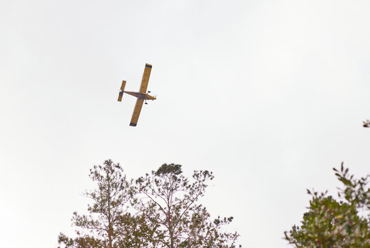 Aerial crop dusting with a plane on adjacent farm land in mid November!
