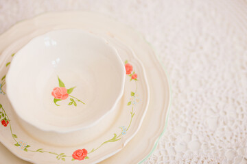 Closeup of porcelain plates and bowls