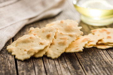 A crispy salted crackers  on wooden table.