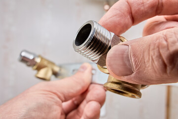 Male faucet reducer adapter with external thread connection to mounting bracket for mixer tap.
