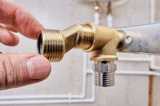 Male tap eccentric reducer dog legs screws into shower faucet mounting bracket.