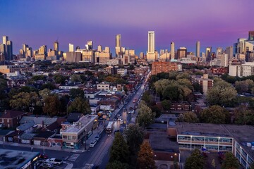 Toronto downtown city skyline and morning traffic on Dundas St W at sunset, Ontario, Canada.
