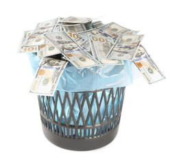 Many dollar banknotes in trash bin isolated on white