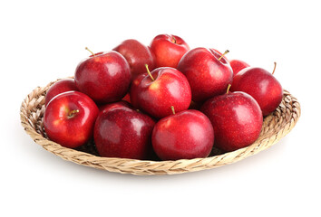 Fresh ripe red apples in wicker bowl isolated on white