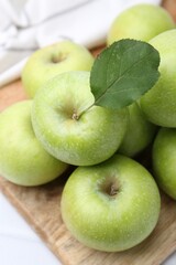 Fresh ripe green apples on table, closeup