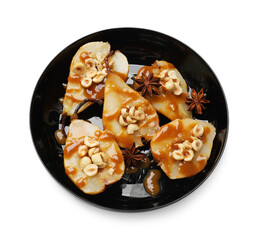 Delicious pears with caramel sauce, nuts and anise stars isolated on white, top view