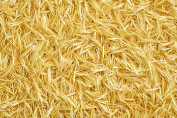 Woven straw texture, intricate natural fibers arranged in a tight, uniform pattern, golden yellow tones