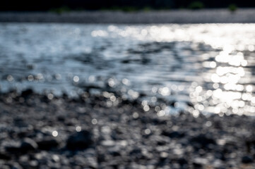 Blurred landscape view on a river, conceptual background. 
