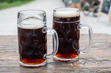 Two glasses of dark beer. Stout, porter, dunkel,dark beer. Friendship and relaxation, free time.