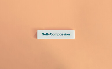 Self-Compassion Word and Banner. Text on Block Letter Tile on Yellow Background. Minimal Aesthetic.