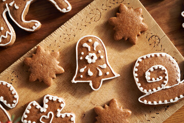 Homemade gingerbread Christmas cookie decorated with white icing