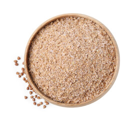 Buckwheat bran in wooden bowl and grains isolated on white, top view