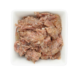 Canned meat in bowl isolated on white, top view