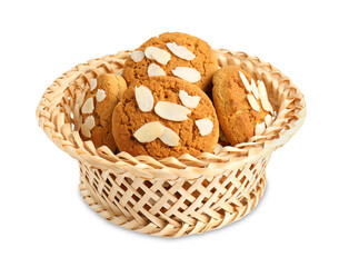 Tasty cookies with almond flakes in wicker basket isolated on white