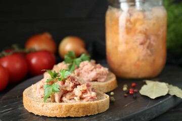 Sandwiches with canned meat and spices on table, closeup
