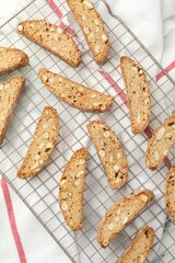Traditional Italian almond biscuits (Cantucci) on table, flat lay