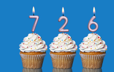 Birthday Cupcakes With Candles Lit Forming The Number 726