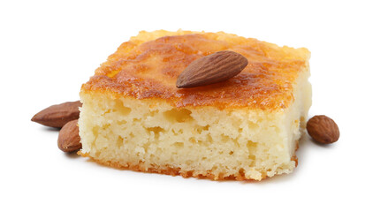 Slice of tasty semolina cake and almonds isolated on white