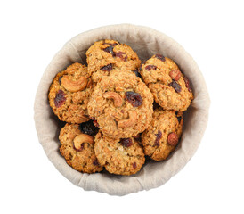 Delicious oatmeal cookies with dried cranberries and nuts in bowl isolated on white, top view