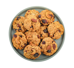 Delicious oatmeal cookies with dried cranberries and nuts isolated on white, top view