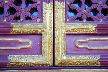 Gilded decoration on wooden windows of Tibetan ancient buildings in Summer Palace, Beijing
