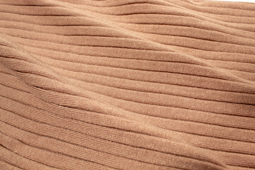 Texture of brown knitted sweater. Background