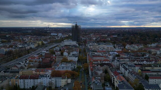 Berlin cloudy skyline over Shopping Street. Smooth aerial view flight drone