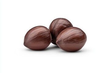 Fototapeta premium Three whole nutmeg seeds on white background